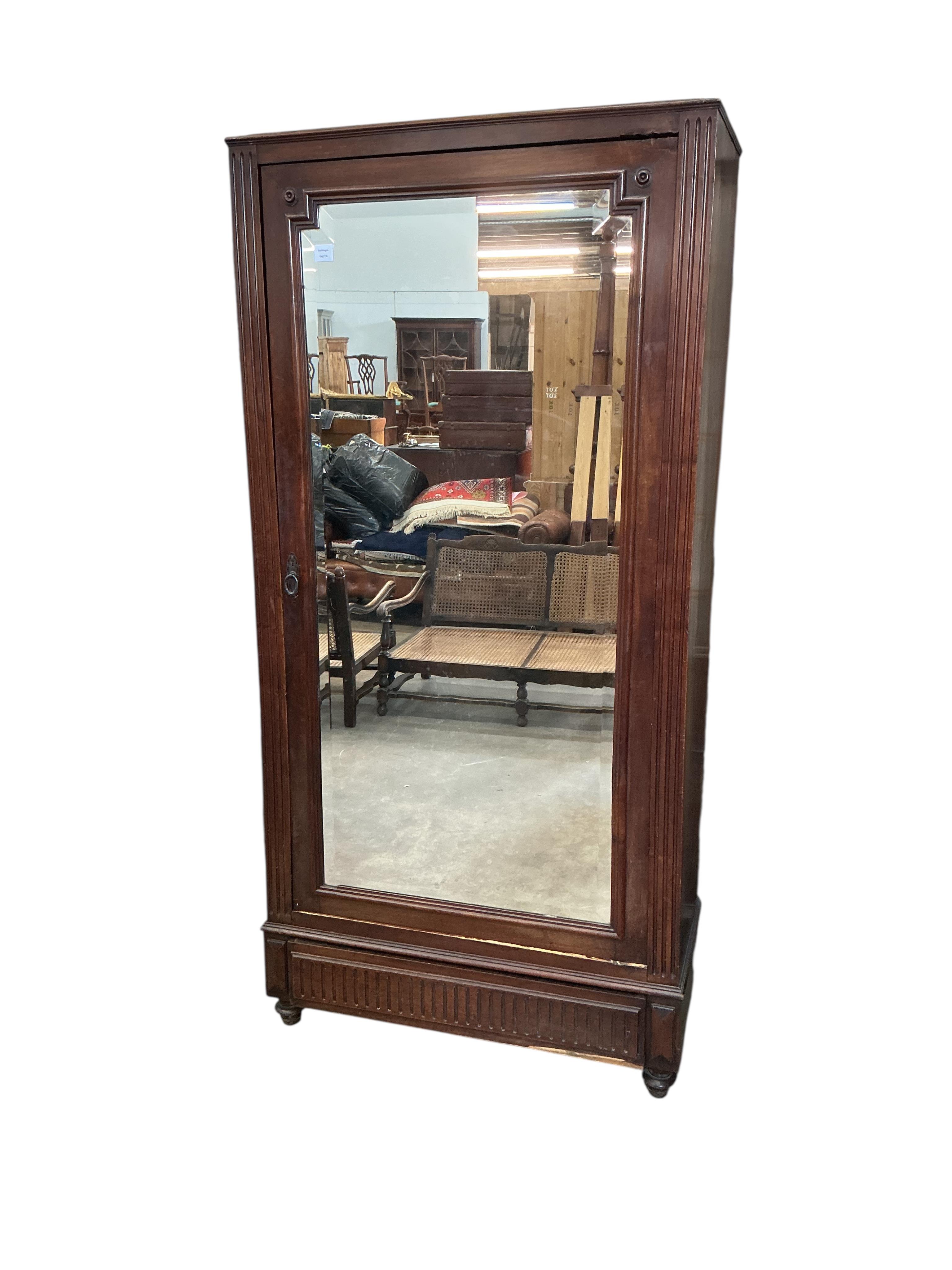 A 19th century French mirrored mahogany armoire, width 98cm, depth 43cm, height 201cm